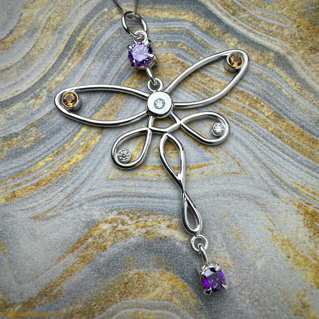 Silver butterfly pendant with the stones set