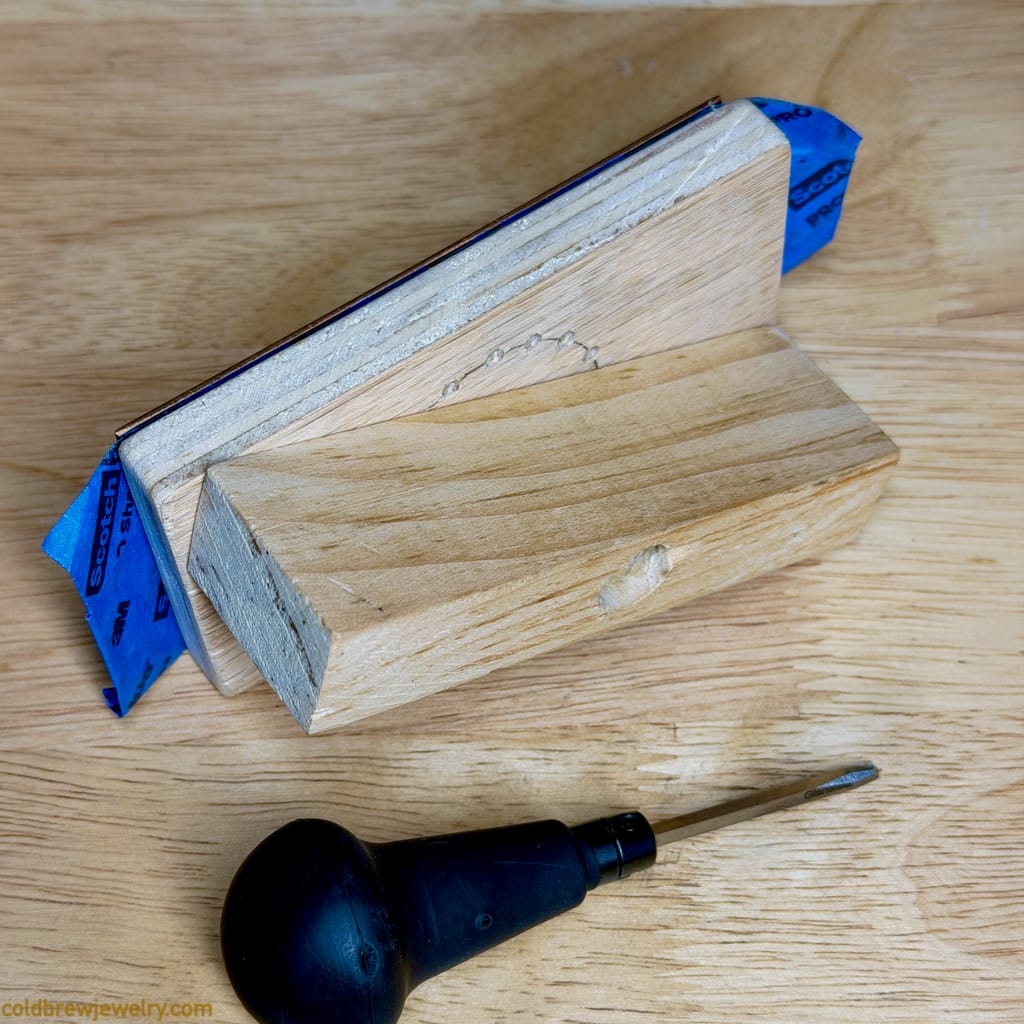 Wooden pivoting workholding fixture for engraving Wooden pivoting workholding fixture for engraving