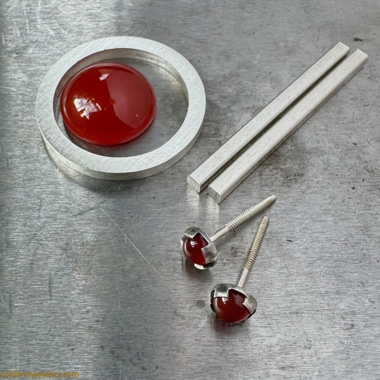 Silver ring shank, carnelian cabochon, silver wire, and silver stud earrings